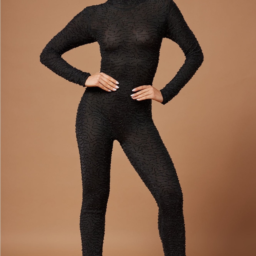 black jumpsuit zipper in back .. Heavy beading (not cheap)